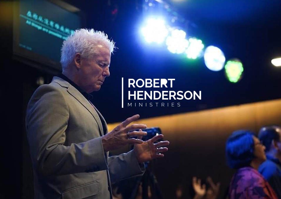 Robert Henderson speaking at a ministry event
